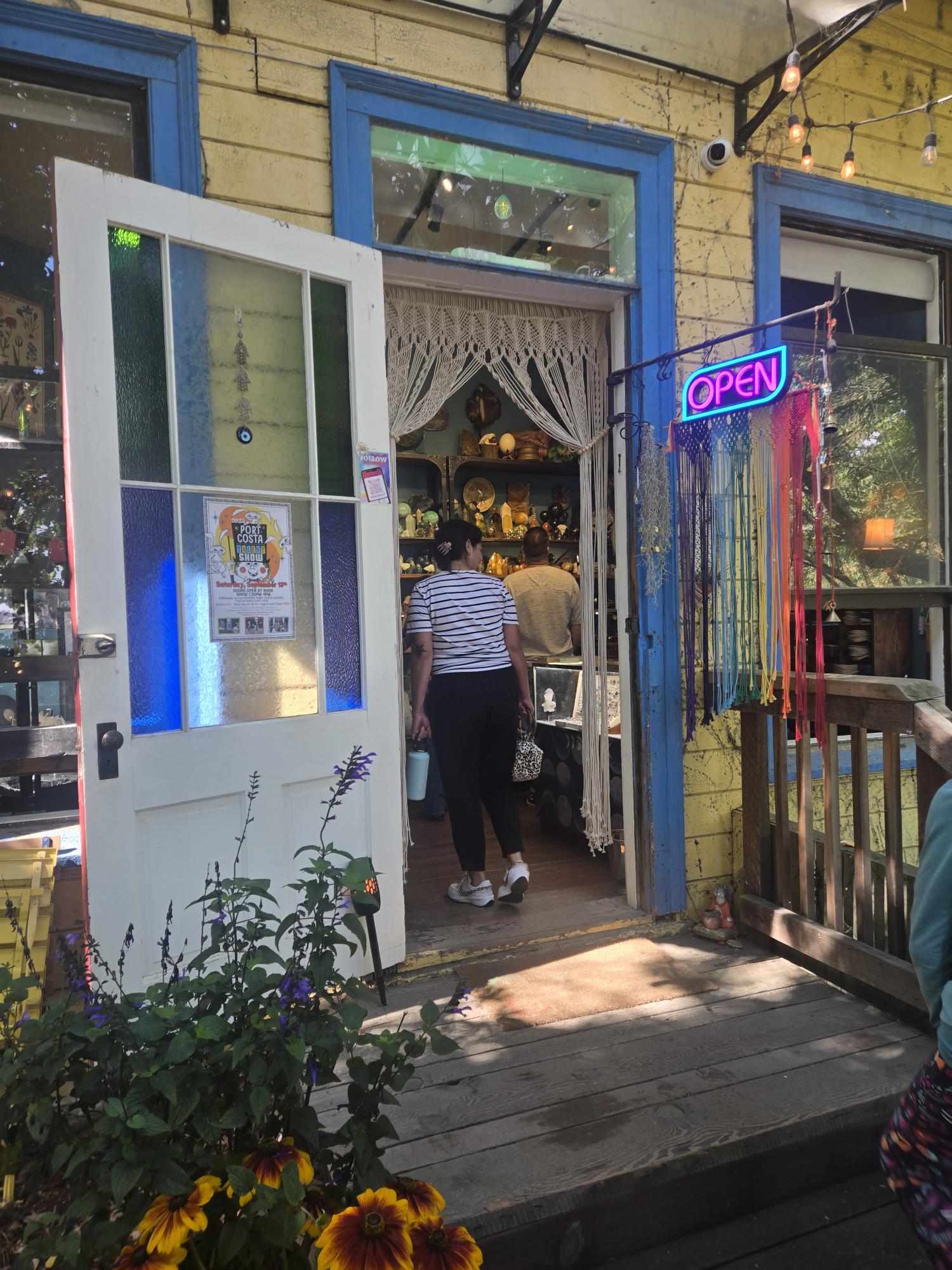 The bright yellow exterior of a historic Port Costa crystal shop